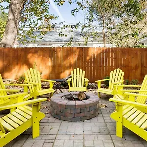 Vibrant, Colorful Building With Backyard Firepit And Games Apartment